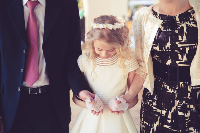 A young girl preparing to receive First Communion