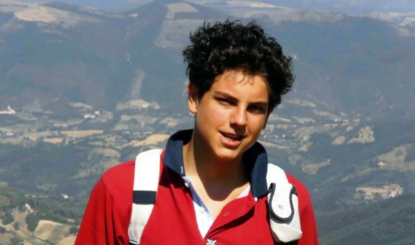 Carlo Acutis in his iconic red t-shirt