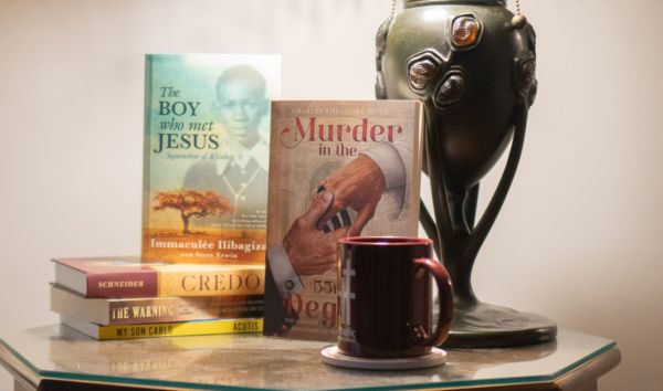 five of our popular books on a coffee table with a steaming cup of coffee.